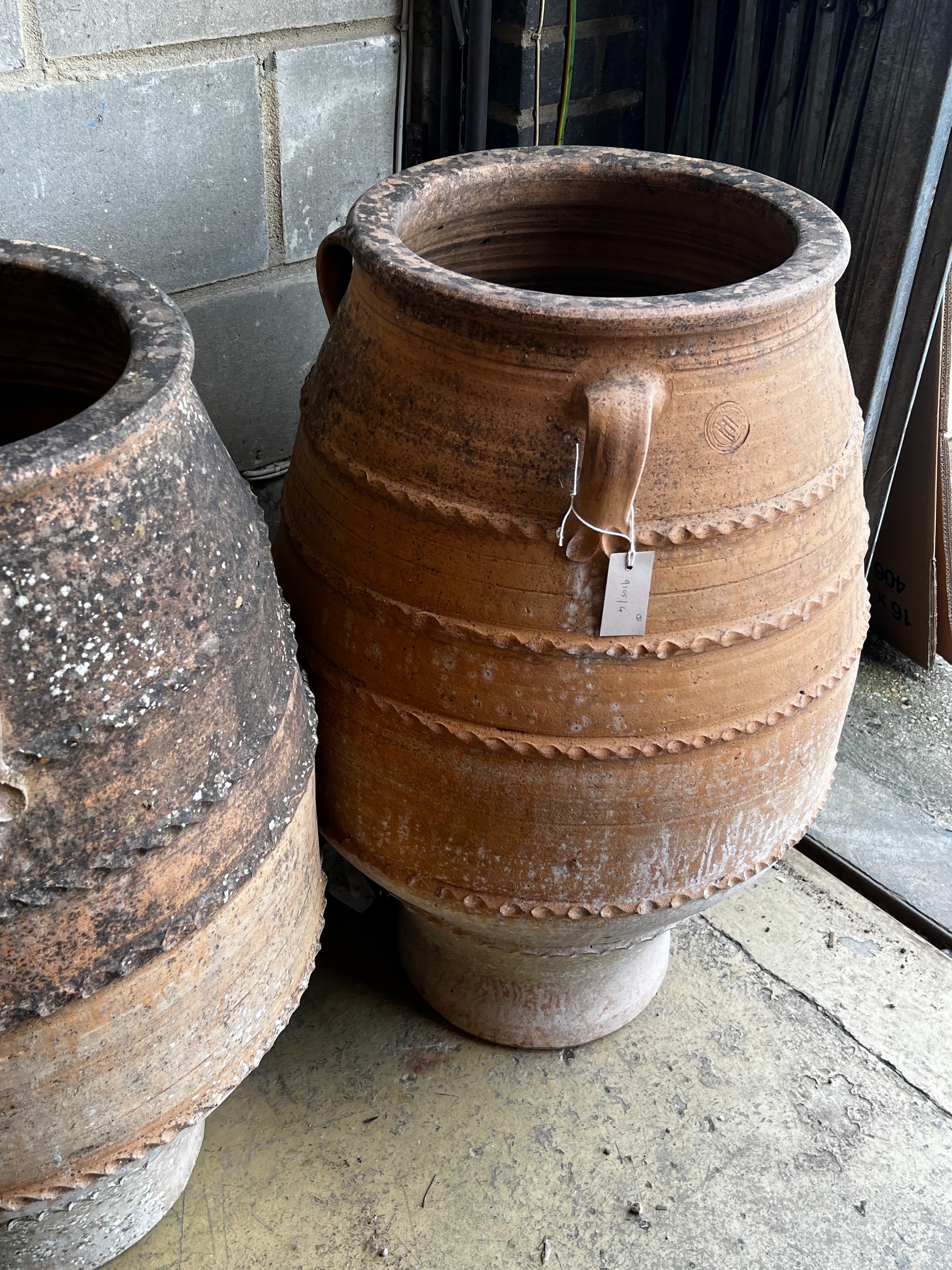 Three Greek terracotta oil jars, largest height 91cm